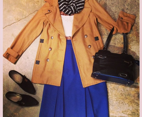 Blue Dress With Tank Jacket Black Purse And Scarf Laying On A Marble Ground