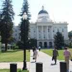 photo of Multiple people in front of the California State Capitol