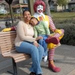 photo of mother, child and Ronald McDonald statue