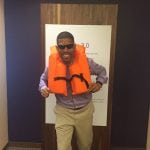 an image of Mayor Kevin Johnson wearing an orange life jacket