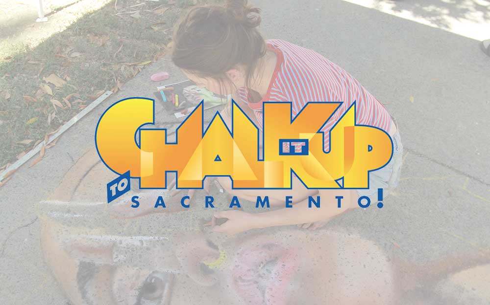 chalk it up logo over image of young woman creating chalk art