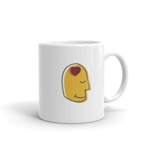 white coffee mug with yellow head with heart