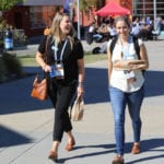 women walking outside at CUE conference