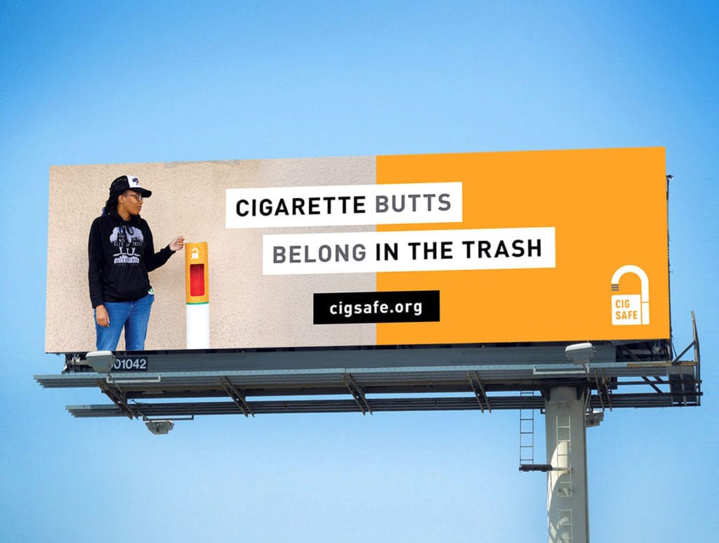 a billboard that says Cigarette Butts Belong in the Trash