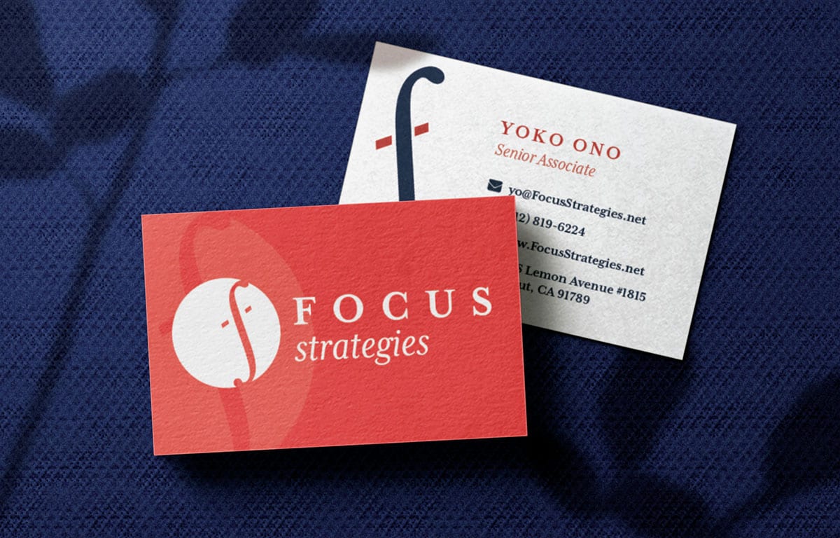 Focus Strategies Red And White Business Cards On Dark Blue Background
