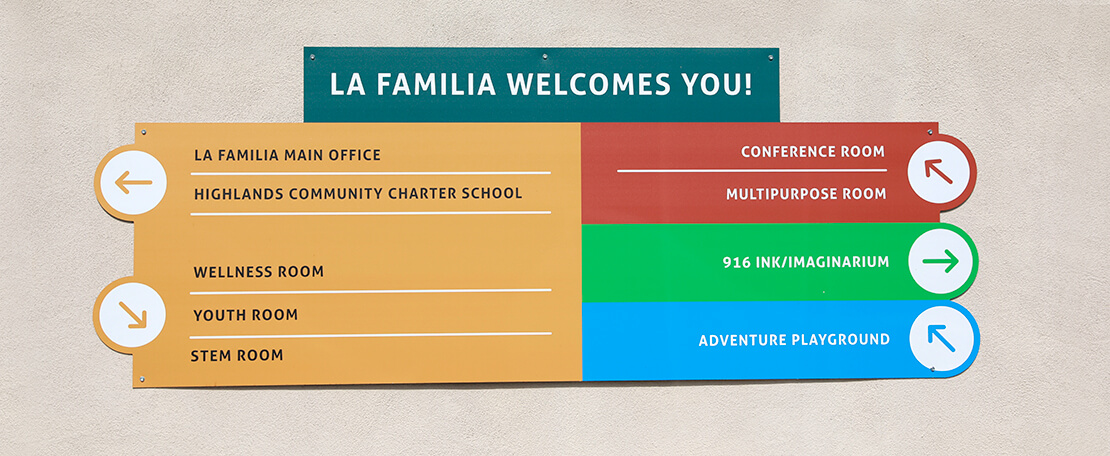 La Familia Welcomes You Signage Hanging On Wall