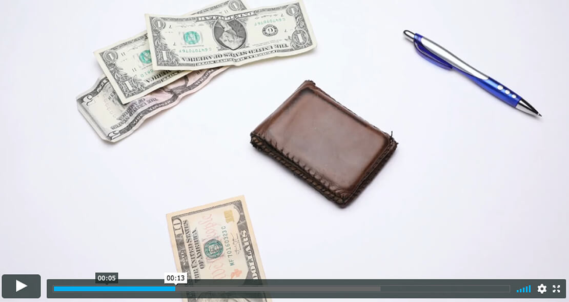 CTEC Stop Motion Video With Brown Wallet And Dollar Bills On White Table With Blue Pen