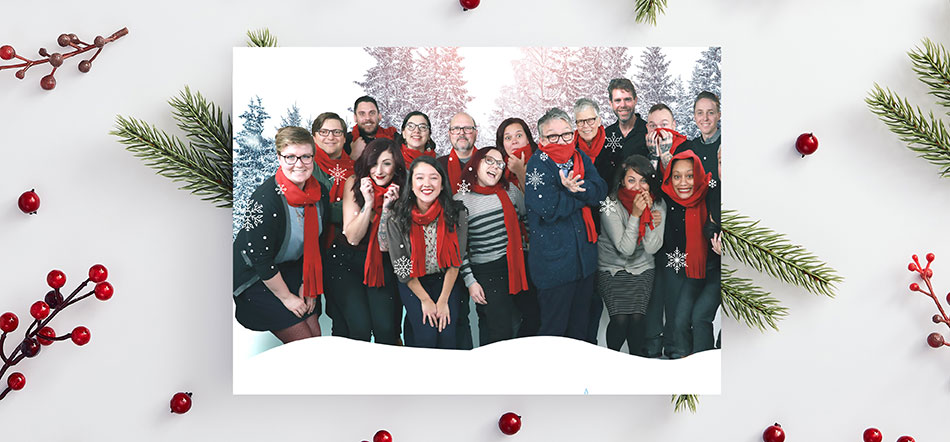 Uptown Studios Holiday Focused Marketing Card With Employees Wearing Red Scarfs And Smiling For Christmas Card
