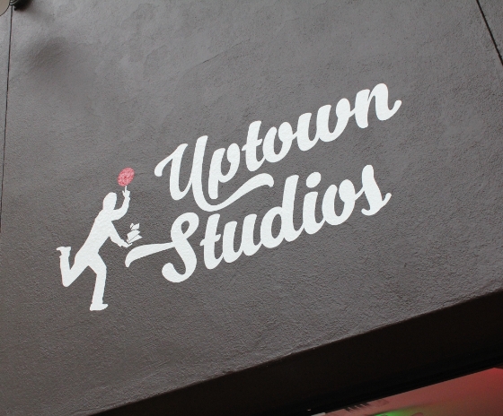 Uptown Studios logo on the outside of building