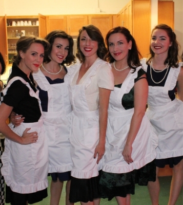 image of five Servers in white aprons