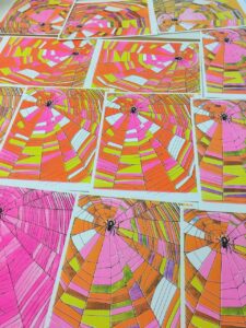 Colorful prints of spiderwebs that Jill made