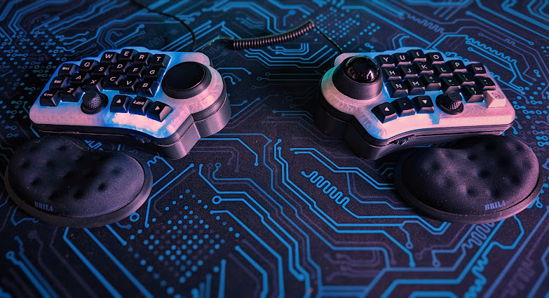 A split keyboard on a blue deskmat