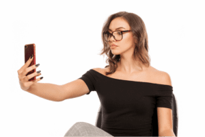 A woman taking a selfie style photograph with her cellphone